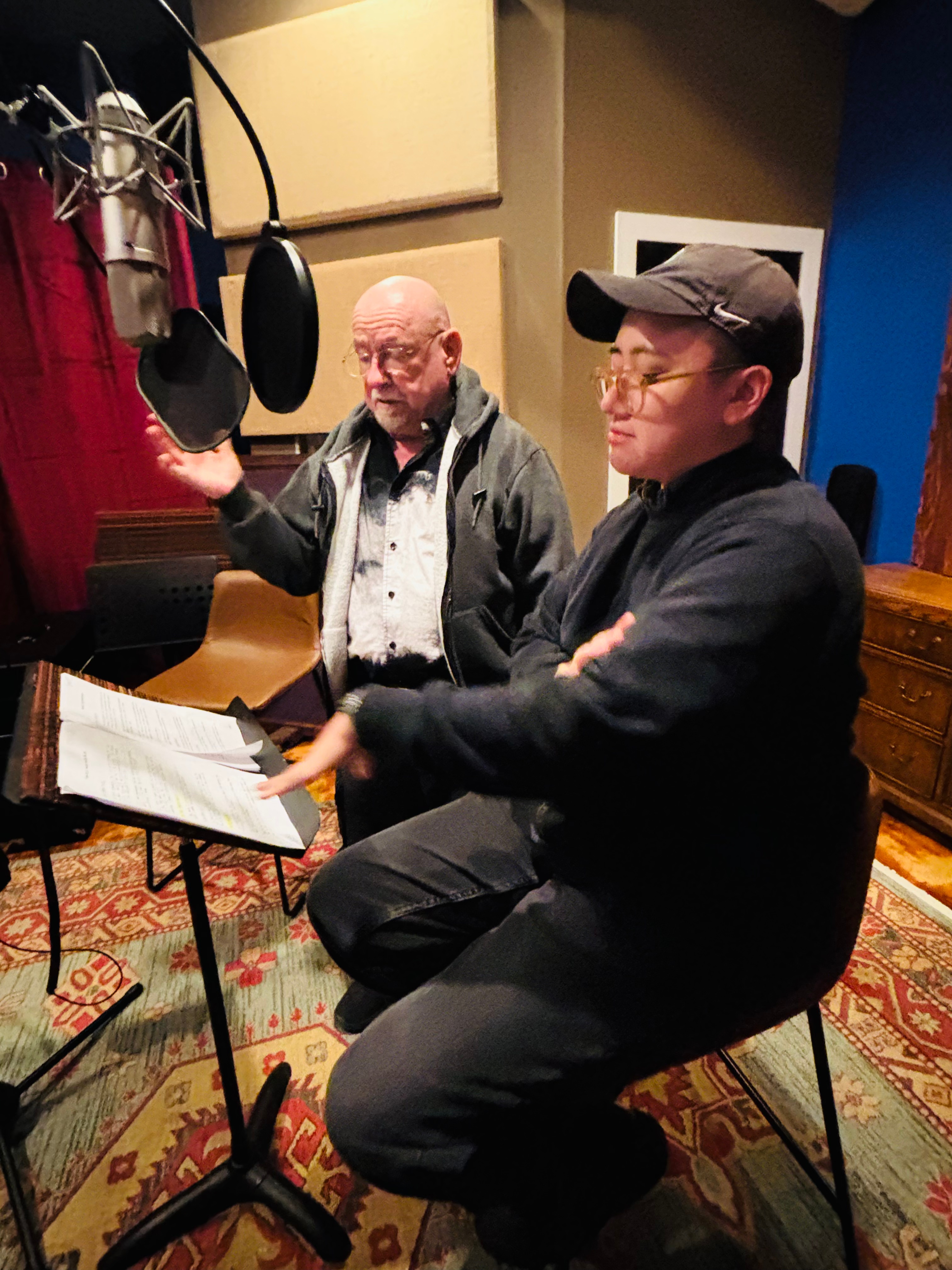 Two mascs in a sound booth